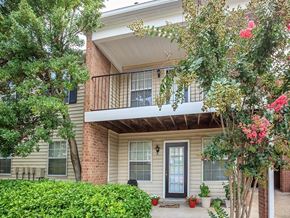 Nashville apartment for rent - the front of a house with a balcony and trees