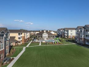 Hendersonville apartment for rent - an aerial view of an apartment complex with a pool and lawn