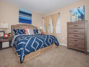 Knoxville apartment for rent - a bedroom with a bed and a dresser