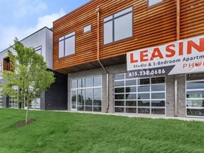 Nashville apartment for rent - a building with a leasing sign on the side of it