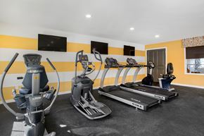 Manchester Township apartment for rent - a gym with cardio machines and flat screen televisions