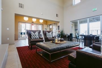 Rocklin apartment for rent - A living room with a red carpet and a brown couch.