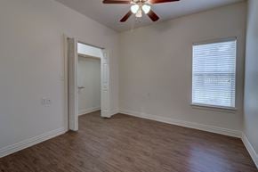 Lindale triplex for rent - Comfortable bedroom at Legend of Lindale, a 55+ active senior living community.
