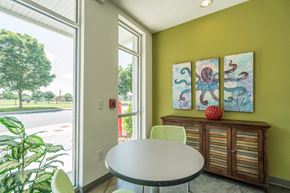 Nashville apartment for rent - a dining room with a table and chairs and a large window