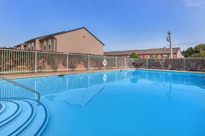 Lebanon apartment for rent - a large swimming pool with a fence around it