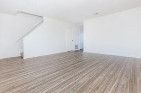 Lebanon apartment for rent - an empty living room with white walls and wood floors