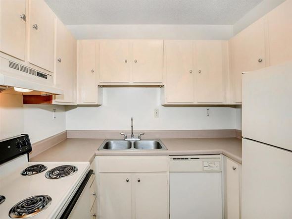 Jackson apartment for rent - a white kitchen with white appliances and white cabinets