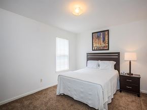 Murfreesboro apartment for rent - a bedroom with a bed and a window