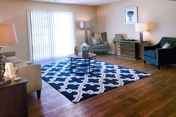 Grandview apartment for rent - A living room with a black and white rug and a grey couch.