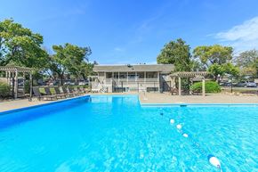 Grandview apartment for rent - A swimming pool with a building in the background.