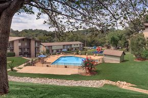 Nashville apartment for rent - an aerial view of a swimming pool with apartments in the background