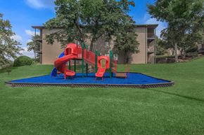 Nashville apartment for rent - a playground in a yard with a building in the background
