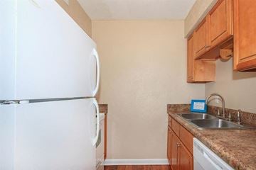Clarksville apartment for rent - a kitchen with a refrigerator and a sink