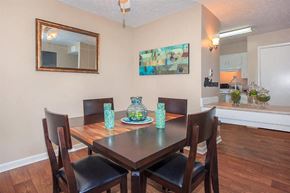 Nashville apartment for rent - a dining room with a wooden table and chairs