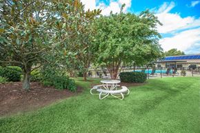 Nashville apartment for rent - a picnic table in a park next to a pool