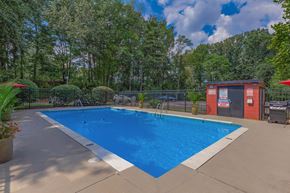 Knoxville apartment for rent - the swimming pool at our apartments with a blue pool