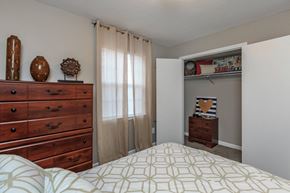 Clarksville apartment for rent - a bedroom with a bed and a dresser