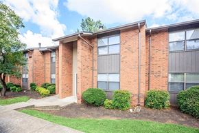 Nashville apartment for rent - a brick building with a sidewalk in front of it