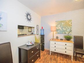 Nashville apartment for rent - a living room with a dresser and a mirror