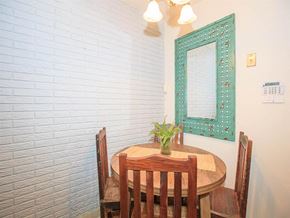 Nashville apartment for rent - a dining room with a wooden table and a mirror