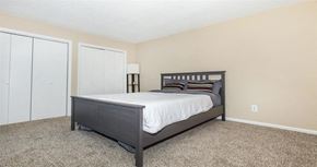 Nashville apartment for rent - a bedroom with a bed and a closet