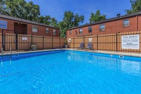 St. Louis apartment for rent - A pool with a sign that says "POOL SAFETY NO LIFEGUARD ON DUTY".