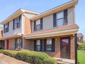 Jackson apartment for rent - the front of a brick apartment building with a sidewalk