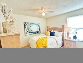 Conway apartment for rent - a bedroom with a bed and a ceiling fan