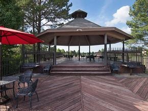 Fort Smith apartment for rent - a gazebo with tables and chairs on a wooden deck