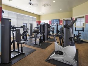 Bryant apartment for rent - a gym with various exercise equipment on the floor