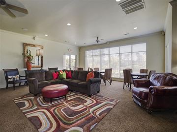 Bryant apartment for rent - a living room with leather furniture and a rug