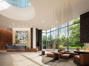 Long Island City apartment for rent - a lobby with couches and chairs and a large window