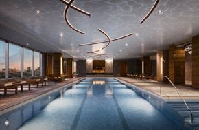 Long Island City apartment for rent - a large swimming pool in a building with large windows