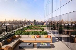 Long Island City apartment for rent - a rendering of a rooftop terrace with a couch and a view of the city