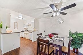 Lake Balboa apartment for rent - a dining room with a table and chairs and a ceiling fan