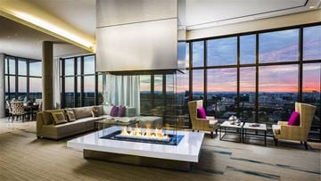 Reston apartment for rent - a living room with a fireplace and a view of the city