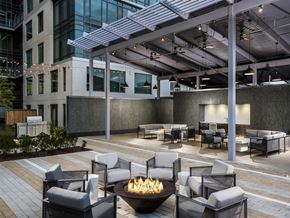 Reston apartment for rent - a lounge area with chairs and a fire pit