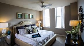 Ashburn apartment for rent - a bedroom with a bed and a ceiling fan