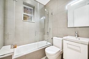 Brooklyn apartment for rent - a renovated bathroom with a shower toilet and sink
