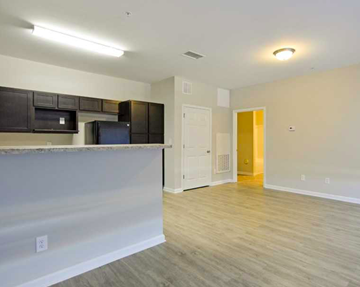 Clayton apartment for rent - an empty room with a kitchen and a counter