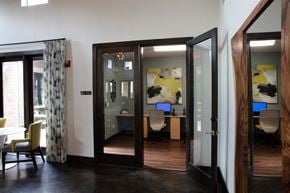 Northlake apartment for rent - a view of a conference room with open doors and a desk with a computer