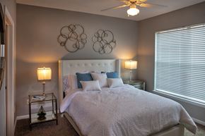 Northlake apartment for rent - a bedroom with a bed and two lamps and a ceiling fan