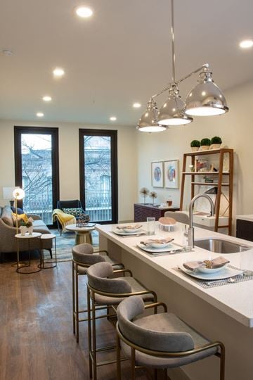 New Orleans apartment for rent - a kitchen and living room with a table and chairs