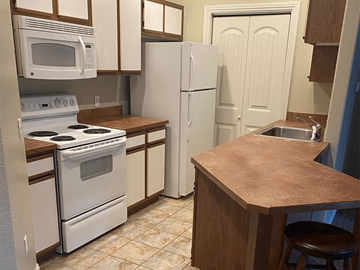 Fayetteville apartment for rent - a kitchen with white appliances and a counter top