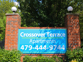 Fayetteville apartment for rent - a sign for crossover terrace apartments on a brick wall
