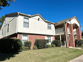 Fayetteville apartment for rent - an apartment building with a lawn in front of it