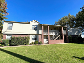 Springdale apartment for rent - an exterior view of an apartment building with a green lawn