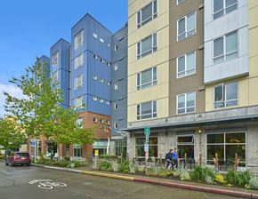 Seattle apartment for rent - a view of the front of a building on a city street
