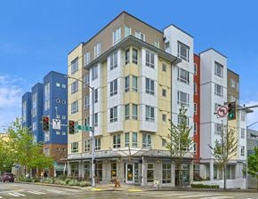 Seattle apartment for rent - a building on the corner of a street with traffic lights
