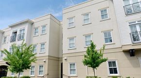 Savannah apartment for rent - a couple of white buildings with trees in front of them